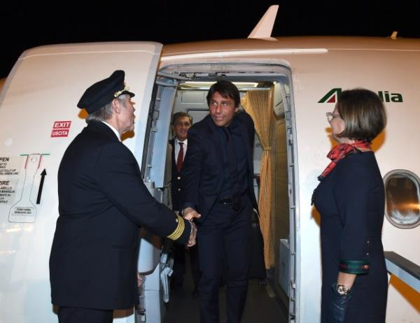 Napoli manager Antonio Conte pictured stepping off an aeroplane in 2019 